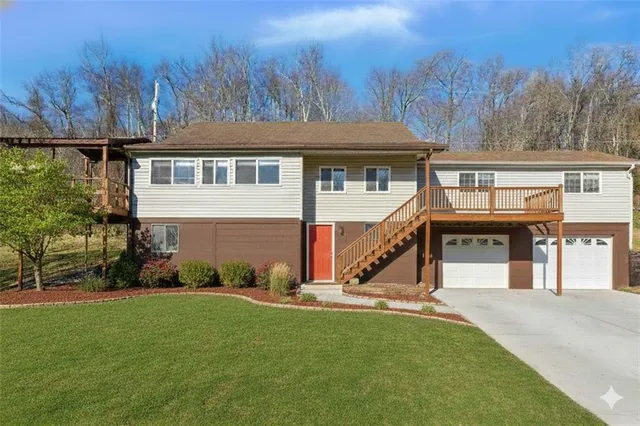 a view of house with yard and entertaining space