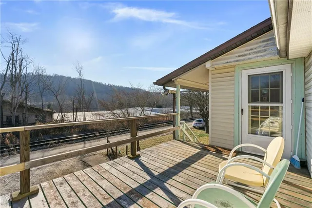 a view of a terrace with couches and sky view