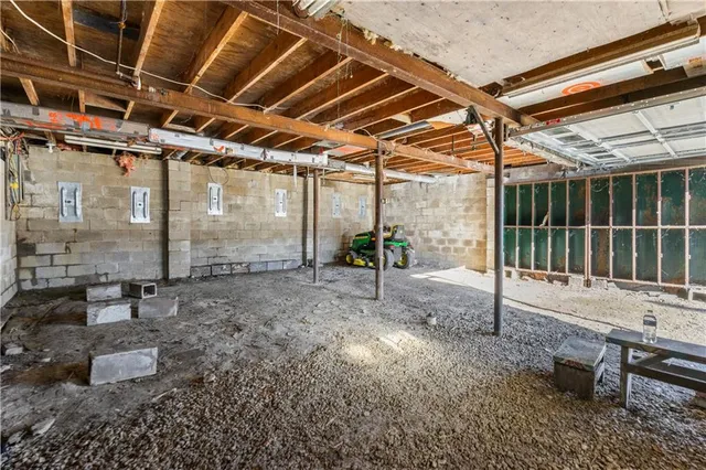 a view of a patio with table and chairs