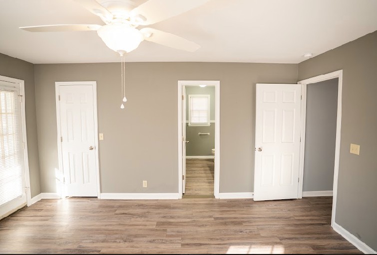 5026 Mt Zion Road Springfield, TN 37172 - Photo 12 of 18 an empty room with wooden floor and windows