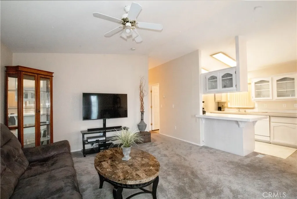 14352 Beach Westminster Ca, Unit 67 Westminster, CA 92683 - Photo 2 of 16 a living room with furniture and a flat screen tv