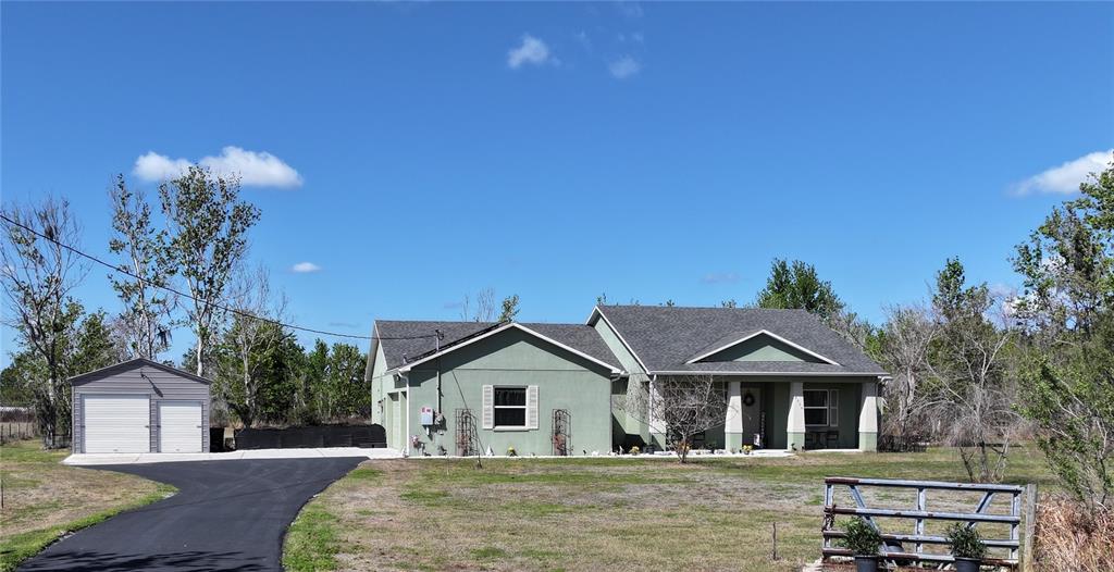 2034 Trail Cut Road Polk City, FL 33868 - Photo 1 of 1 a front view of a house with a yard