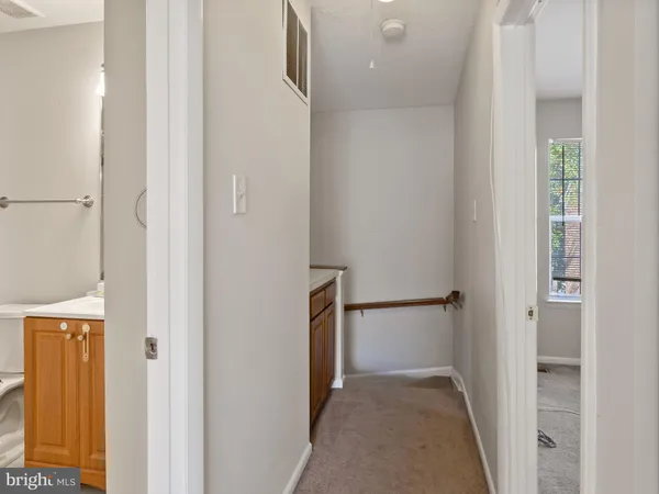 a view of a hallway with a white walls