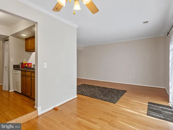 a view of an empty room and wooden floor