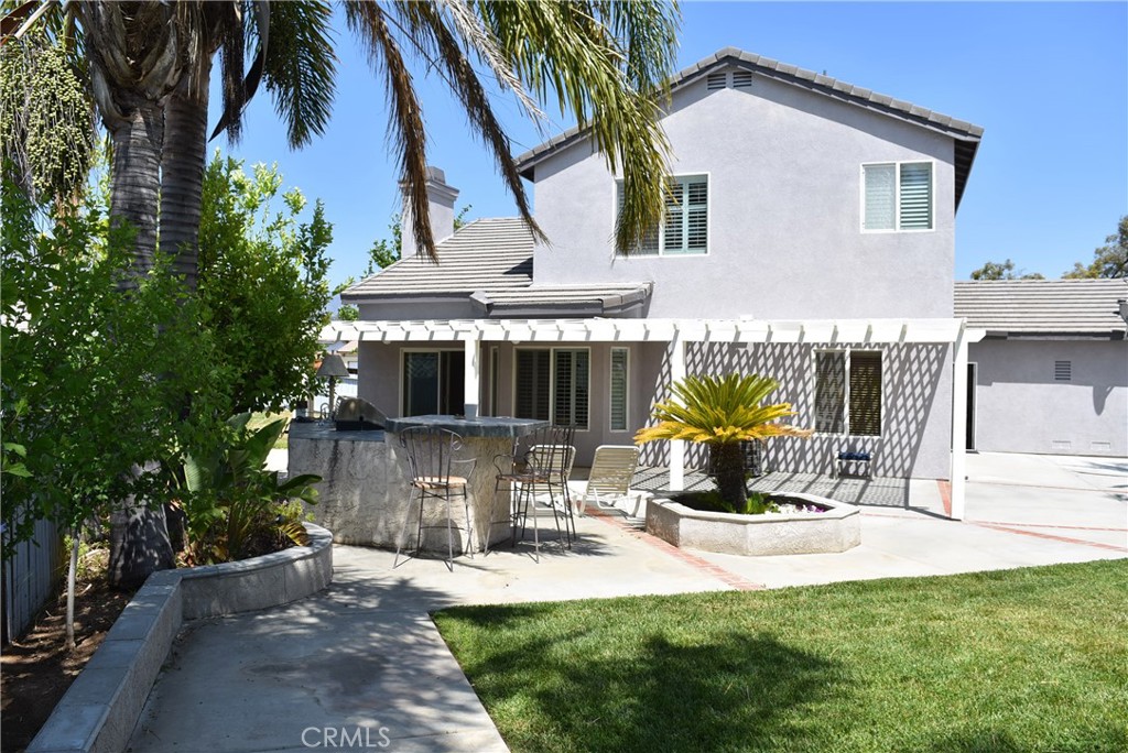 1665 Ravenswood Road Beaumont, CA 92223 - Photo 33 of 41 a house view with a sitting space and garden space