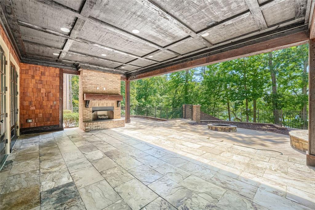 7965 Robin Road Cumming, GA 30041 - Photo 45 of 64 a view of a porch with furniture and a backyard