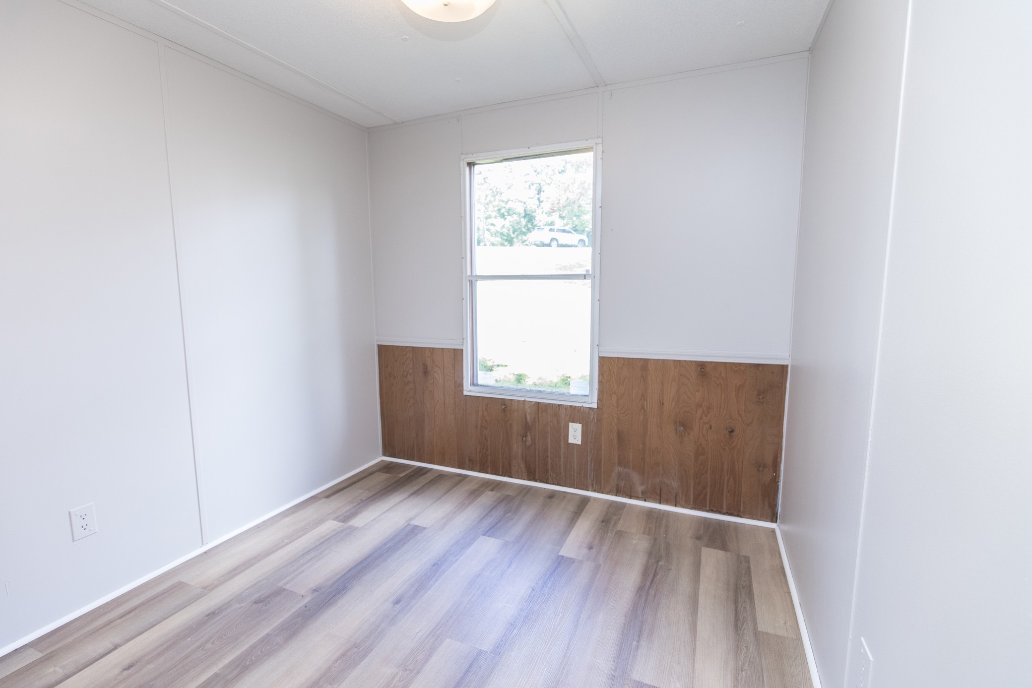 1304 Shell Road Goodlettsville, TN 37072 - Photo 13 of 40 an empty room with wooden floor and windows