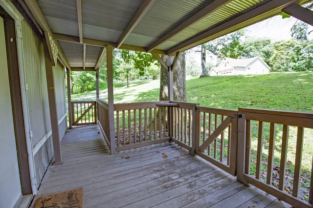 a view of porch with wooden floor
