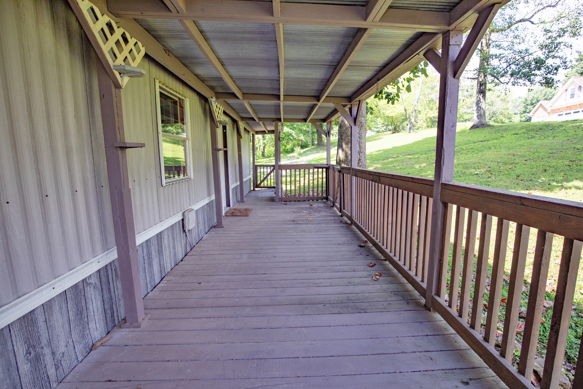 1304 Shell Road Goodlettsville, TN 37072 - Photo 21 of 40 a view of a porch with wooden floor and stairs