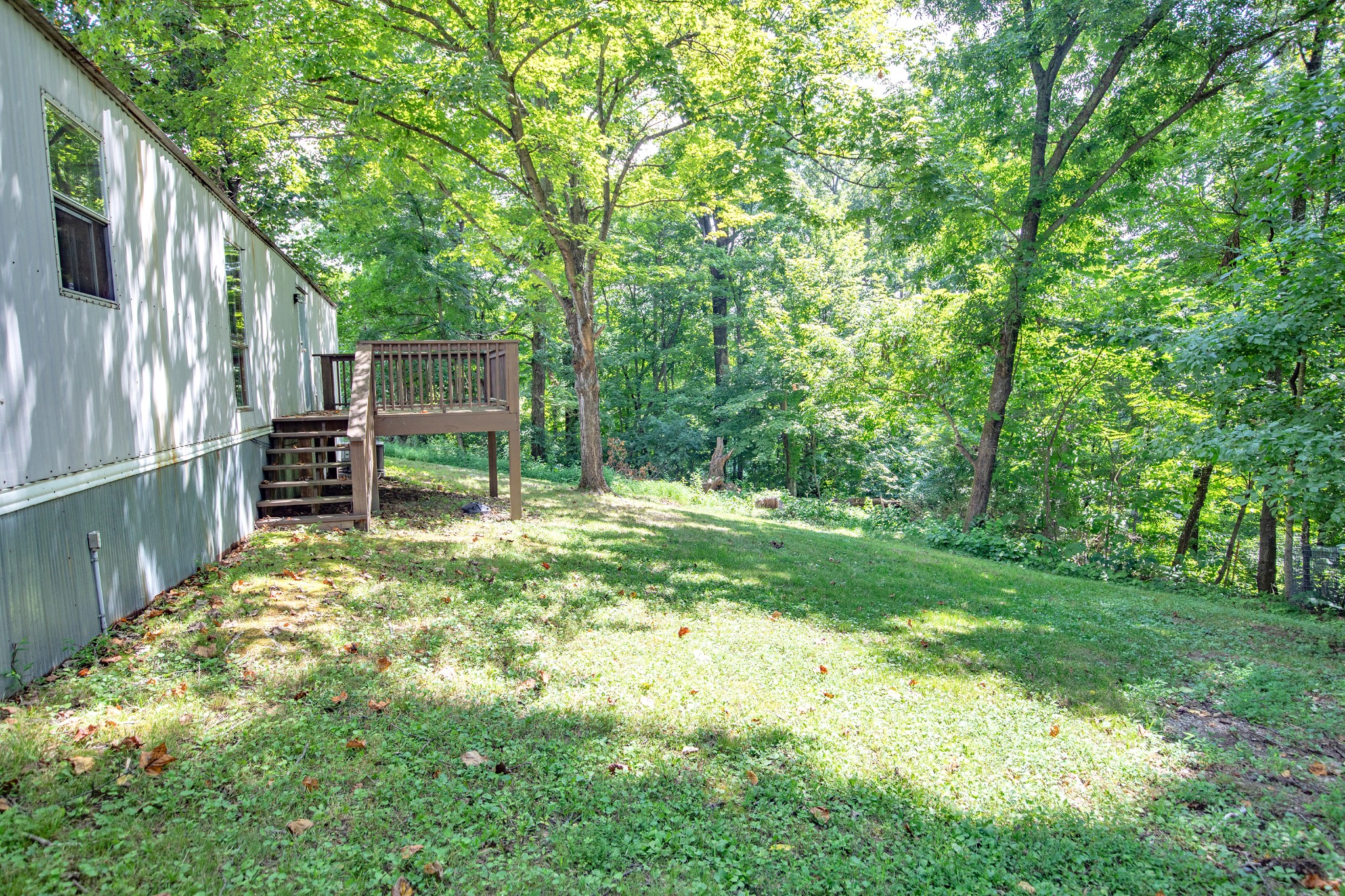 1304 Shell Road Goodlettsville, TN 37072 - Photo 24 of 40 a backyard of a house with table and chairs
