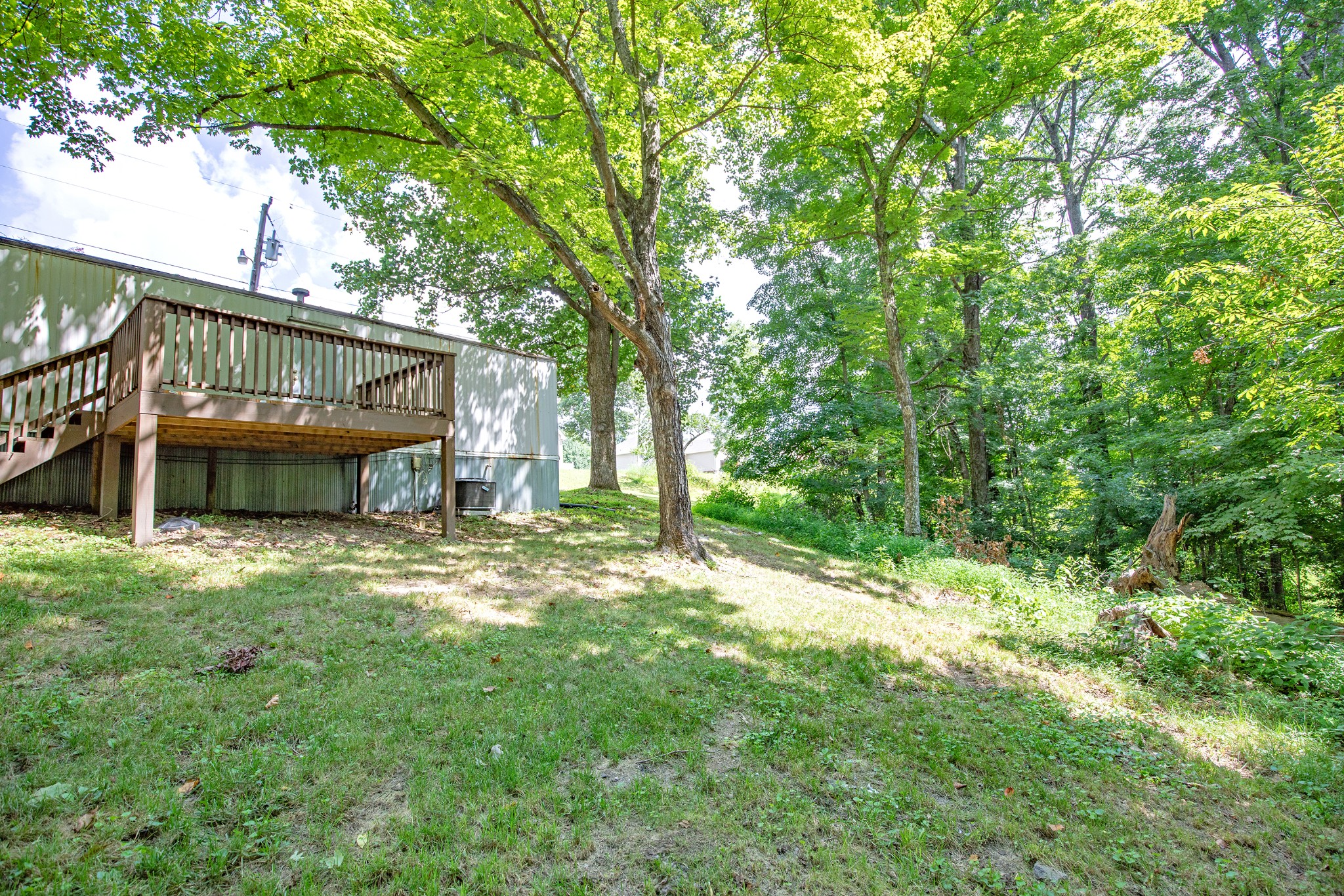 1304 Shell Road Goodlettsville, TN 37072 - Photo 25 of 40 a view of a house with backyard and a tree