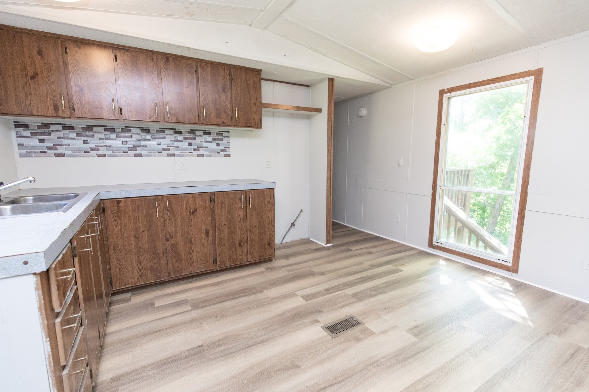 1304 Shell Road Goodlettsville, TN 37072 - Photo 5 of 40 a view of a kitchen with a sink and a stove top oven
