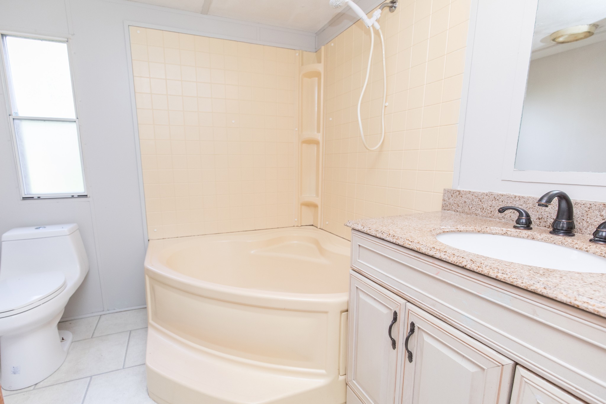 1304 Shell Road Goodlettsville, TN 37072 - Photo 7 of 40 a bathroom with a granite countertop sink toilet and shower