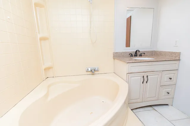 a bathroom with a bathtub and a sink