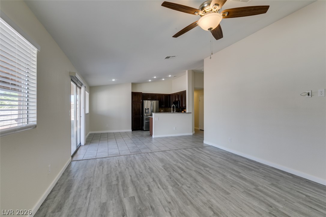 2028 Rustler Ridge Avenue North Las Vegas, NV 89031 - Photo 13 of 40 An open-concept living space integrates a well-appointed kitchen, ideal for entertaining.