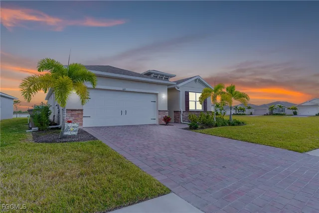 a front view of house with yard and green space