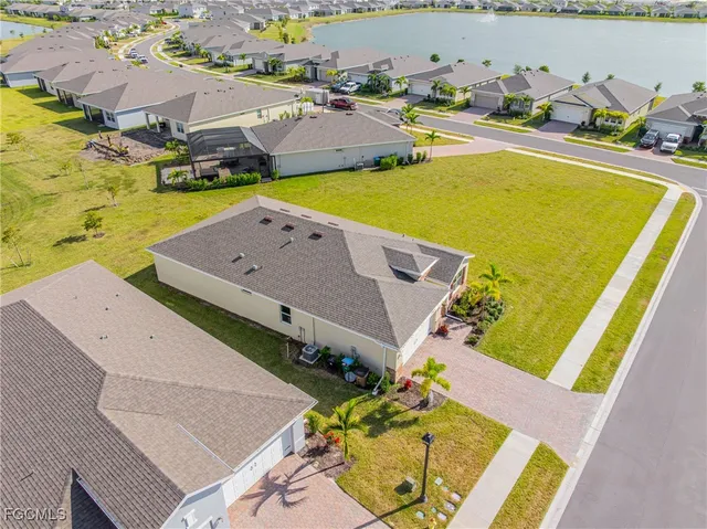 an aerial view of a house with a swimming pool