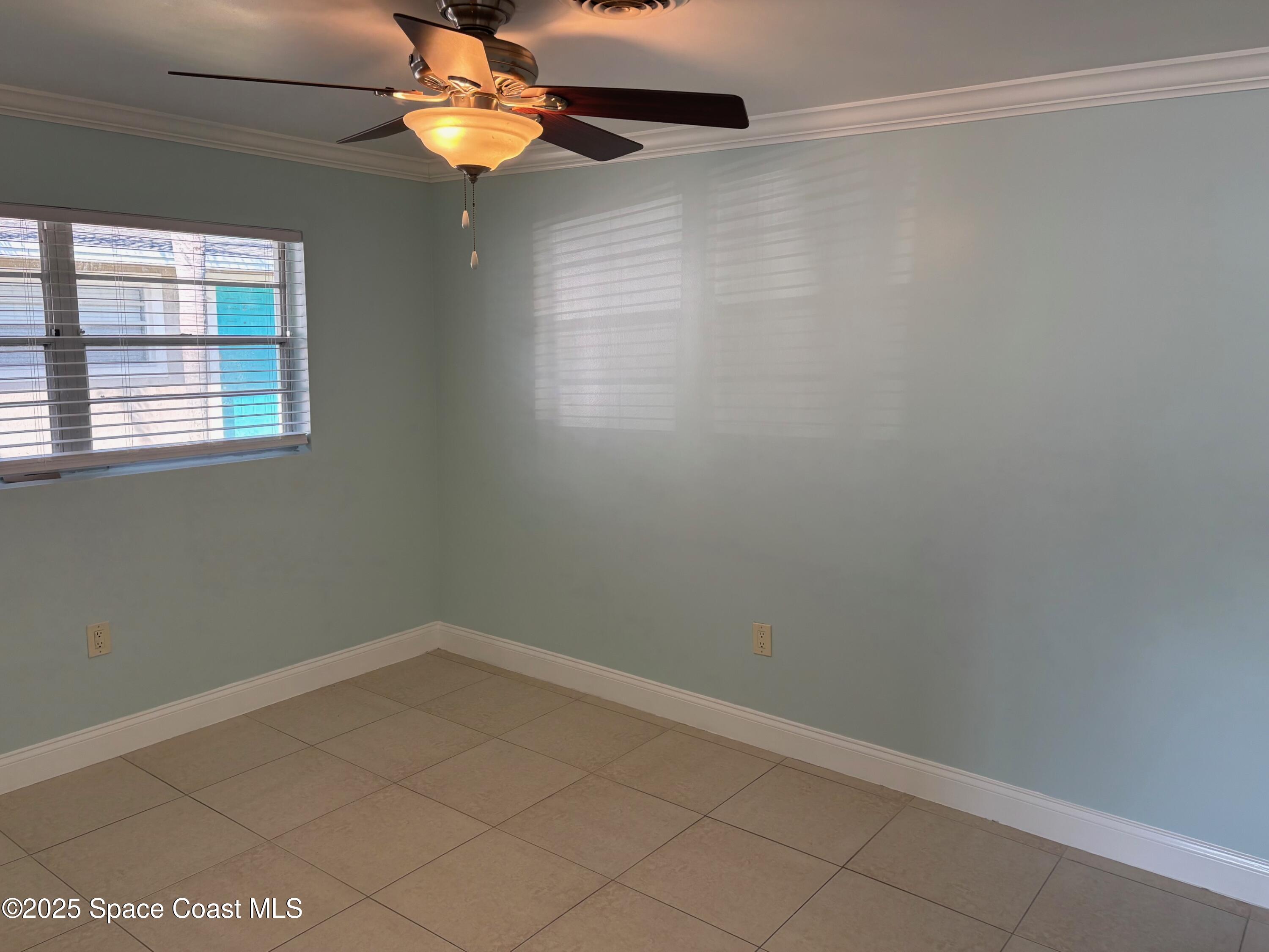 306 Johnson Avenue, Unit 5 Cape Canaveral, FL 32920 - Photo 12 of 17 a room with a window