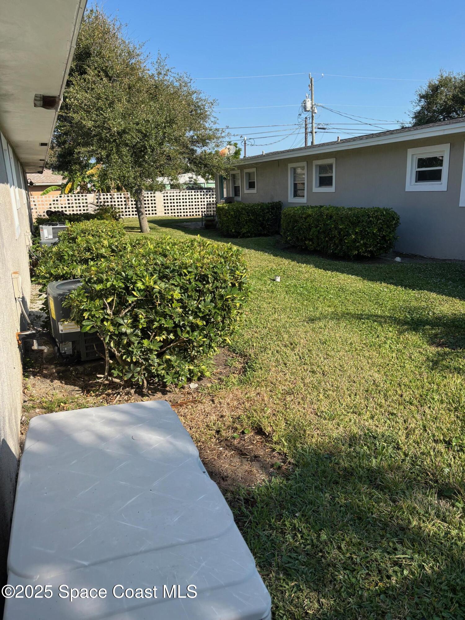 306 Johnson Avenue, Unit 5 Cape Canaveral, FL 32920 - Photo 16 of 17 a view of a garden