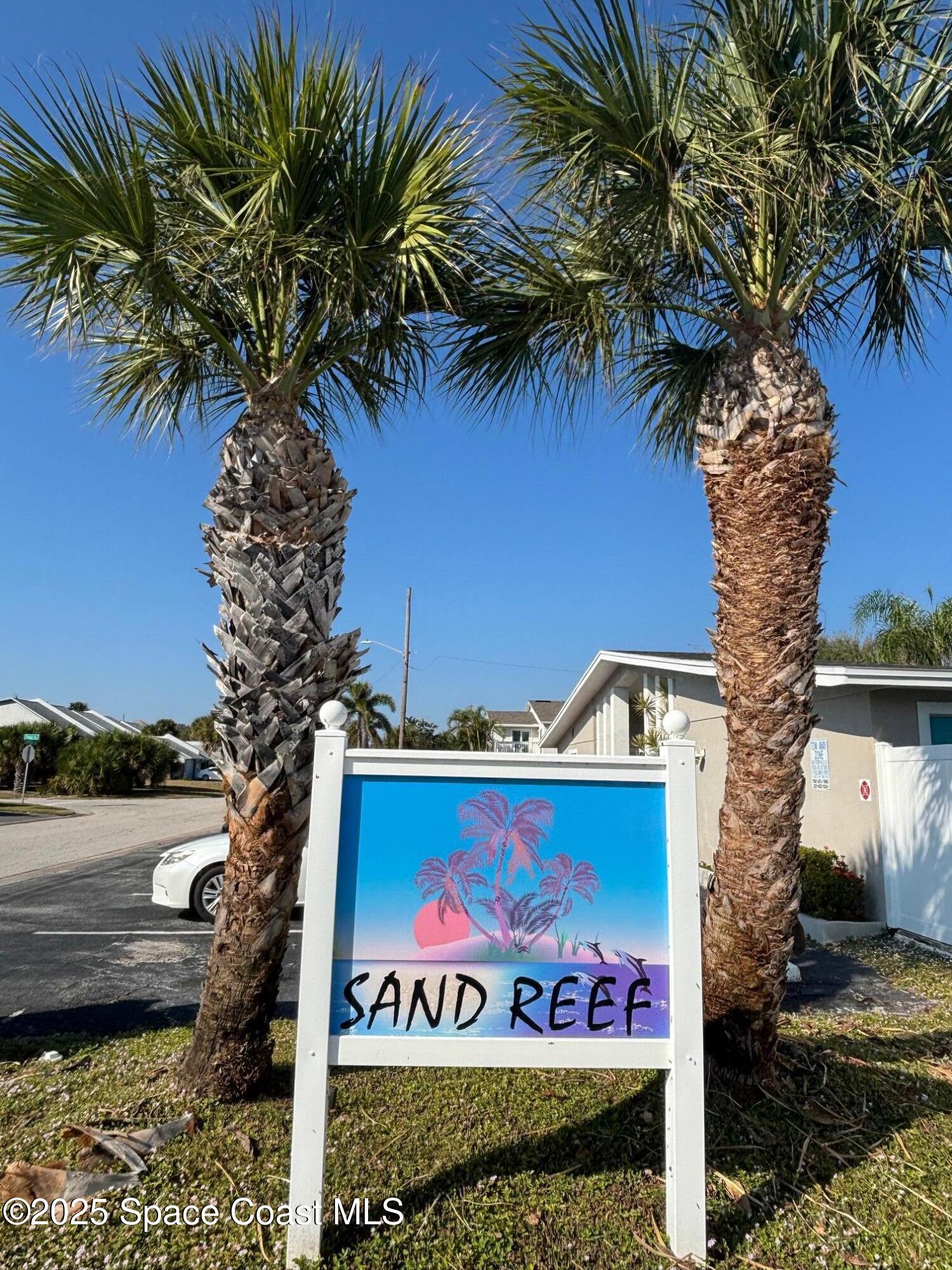 306 Johnson Avenue, Unit 5 Cape Canaveral, FL 32920 - Photo 17 of 17 a sign that is on the wall of a building