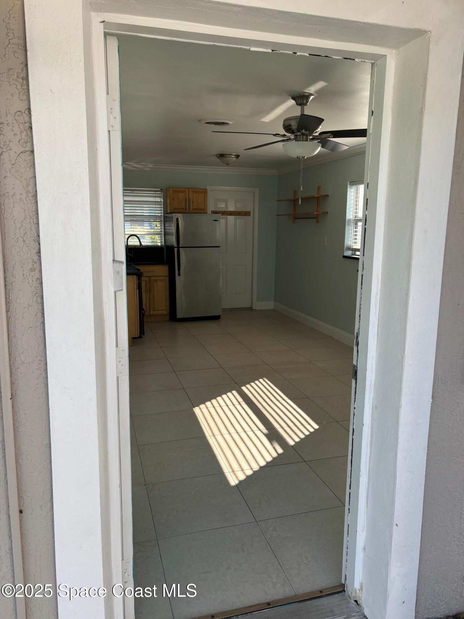 306 Johnson Avenue, Unit 5 Cape Canaveral, FL 32920 - Photo 7 of 17 a view of kitchen and utility room