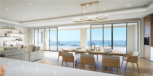 a dining hall with couches a coffee table and chairs with outer view