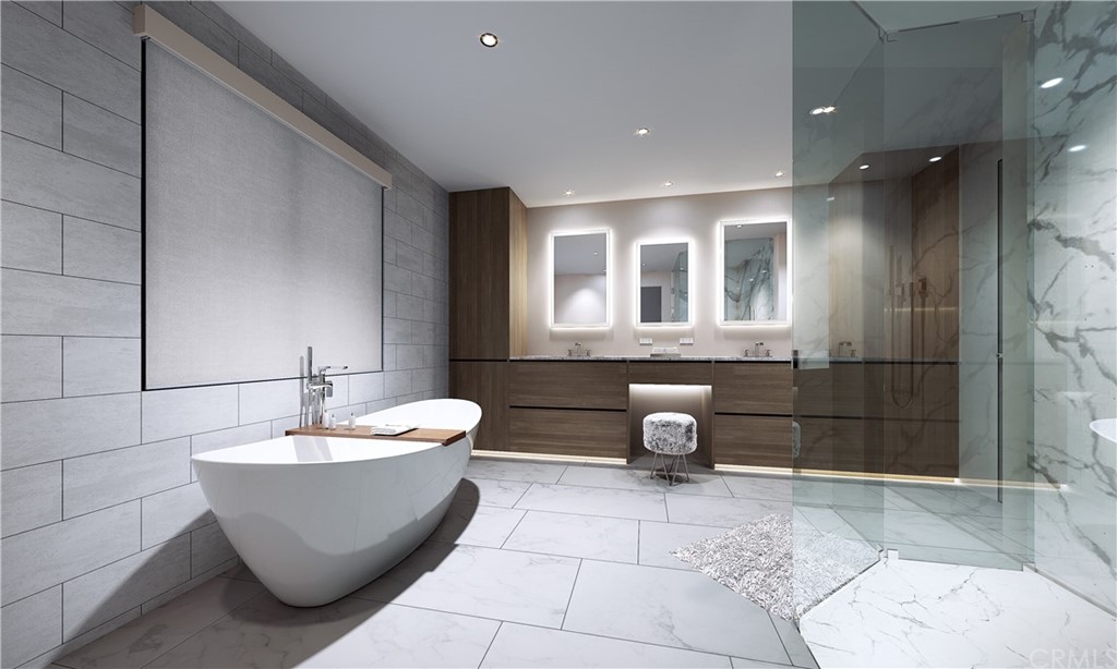 9 Seabreeze Terrace Dana Point, CA 92629 - Photo 21 of 34 a bathroom with a bathtub and shower