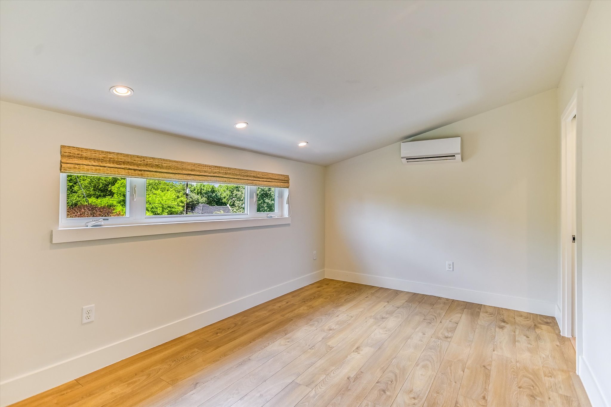 1605 Hether Street Austin, TX 78704 - Photo 24 of 26 Room featuring wood-finish flooring, recessed lighting, and a ductless mini-split system