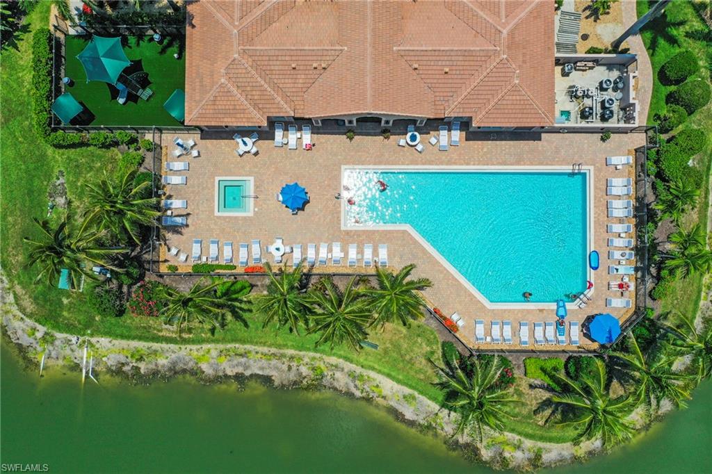 3916 Cherrybrook Loop Fort Myers, FL 33966 - Photo 27 of 31 Expansive outdoor aquatic area featuring a large swimming pool and a separate spa