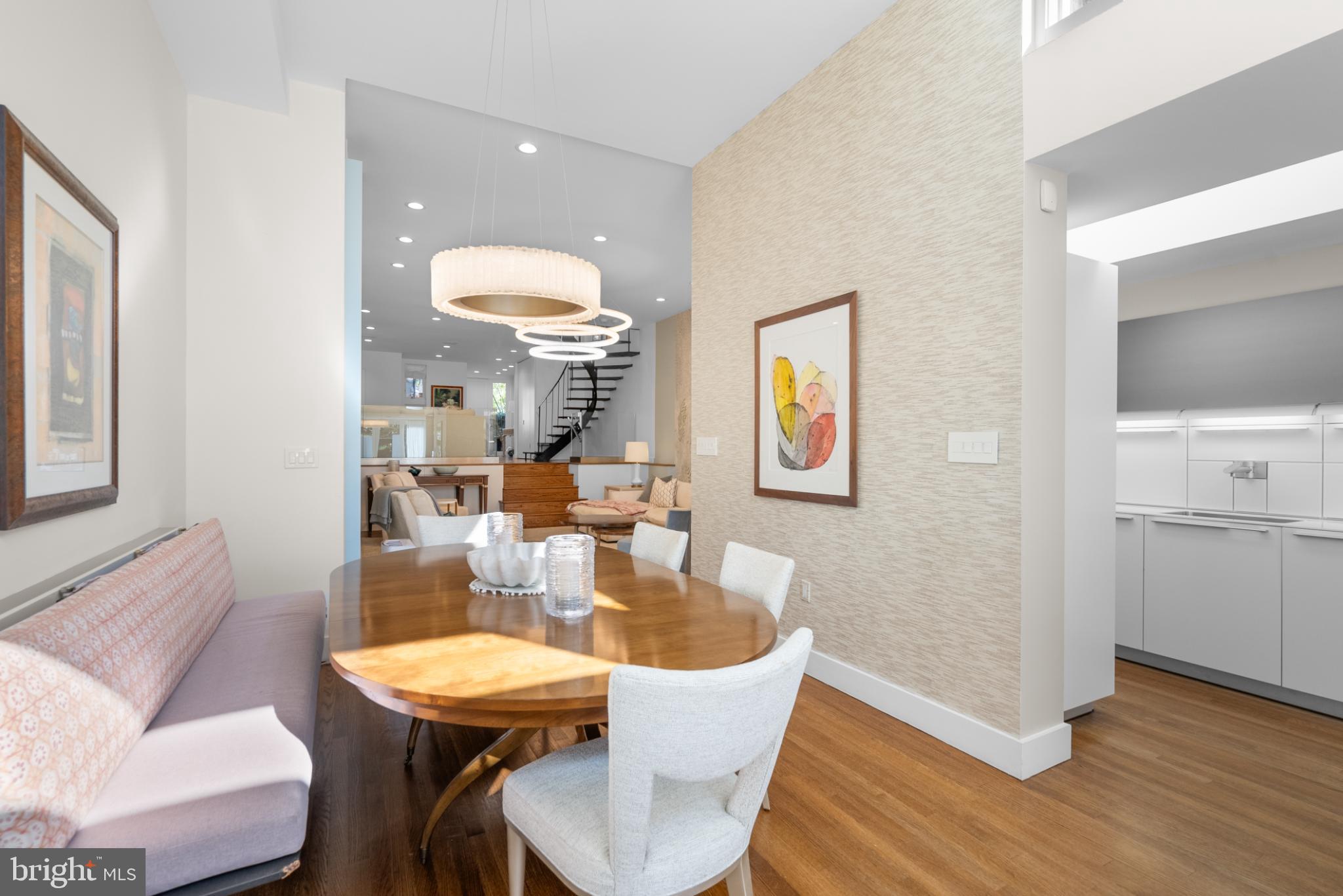 3322 Dent Place Northwest Washington, DC 20007 - Photo 15 of 41 a dining room with wooden floor a glass table and chairs