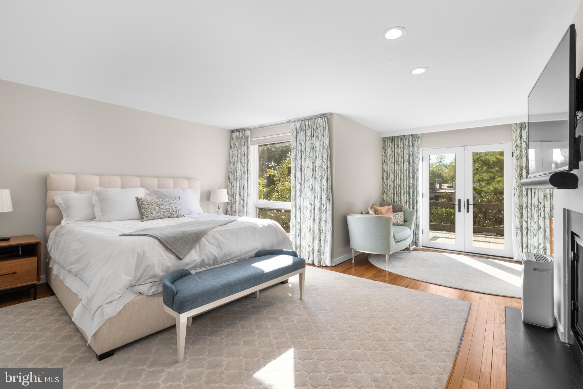 3322 Dent Place Northwest Washington, DC 20007 - Photo 21 of 41 a spacious bedroom with a bed and glass door