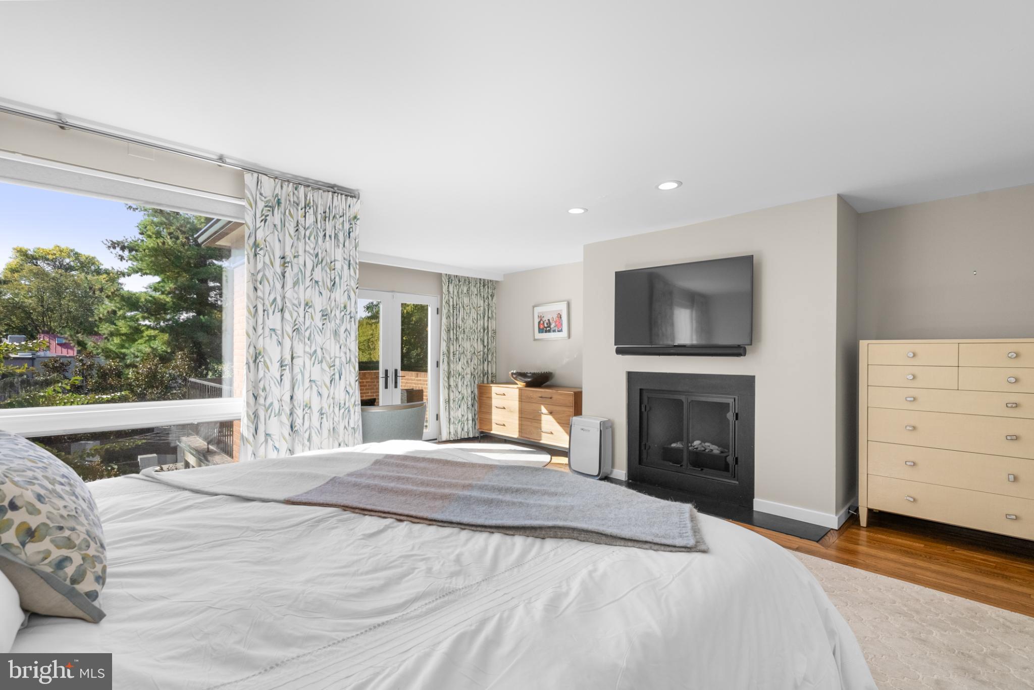 3322 Dent Place Northwest Washington, DC 20007 - Photo 22 of 41 a bedroom with a bed and a fireplace