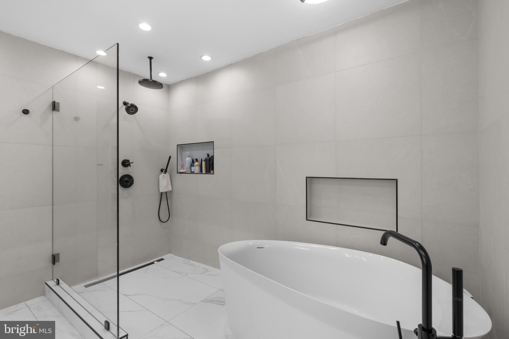 3322 Dent Place Northwest Washington, DC 20007 - Photo 27 of 41 a bathroom with a bathtub and a shower