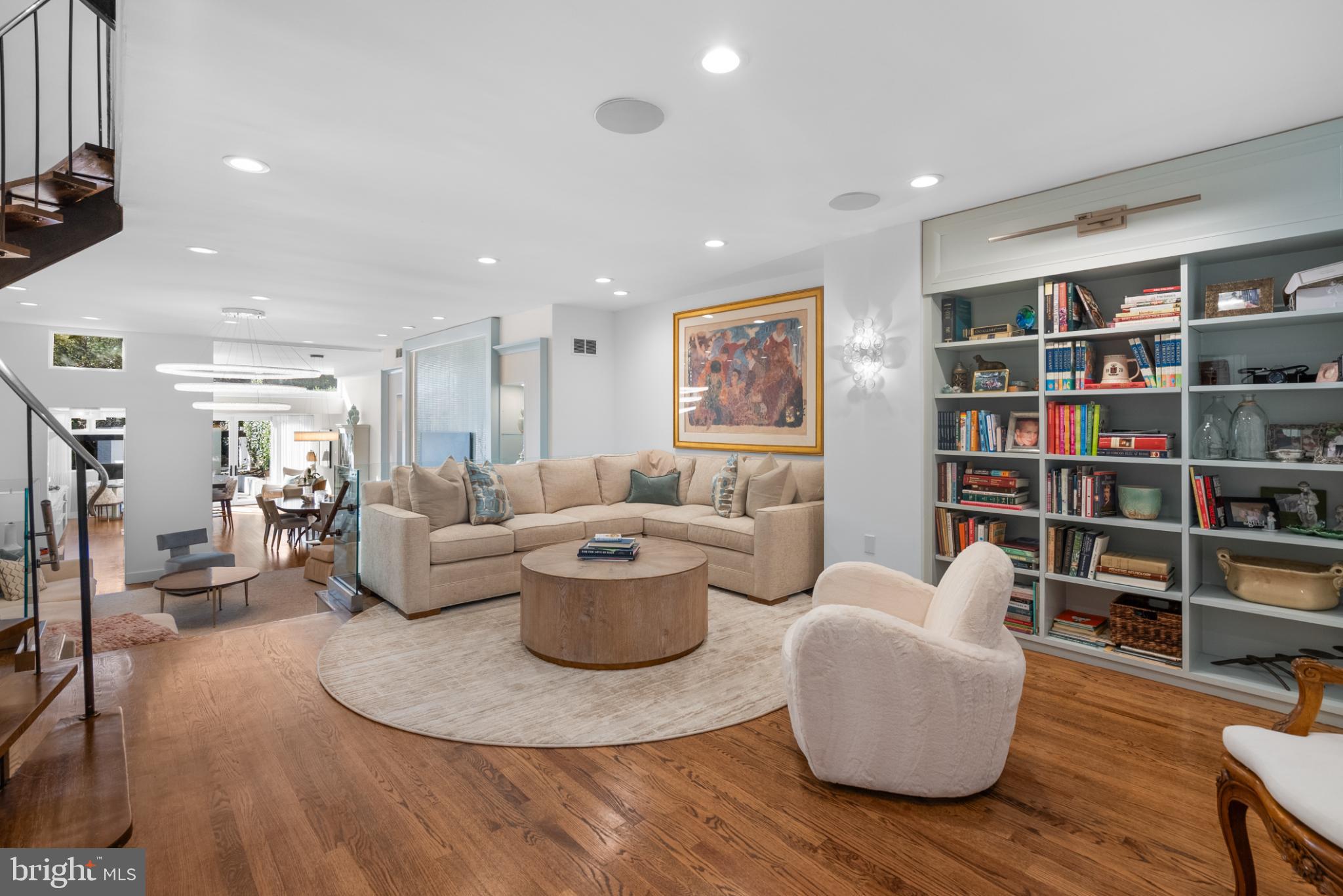 3322 Dent Place Northwest Washington, DC 20007 - Photo 3 of 41 a living room with furniture and a book shelf