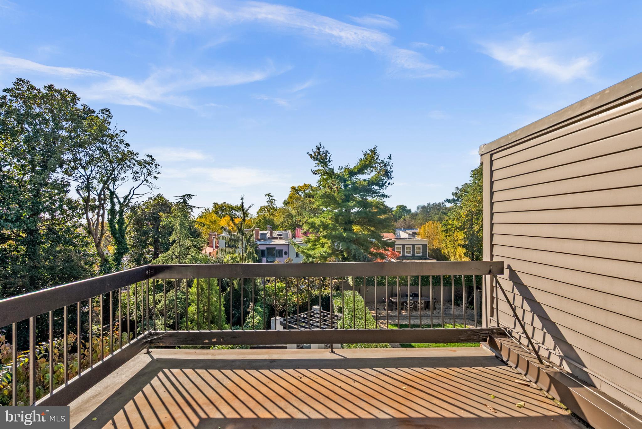 3322 Dent Place Northwest Washington, DC 20007 - Photo 33 of 41 a view of a balcony with wooden floor and fence
