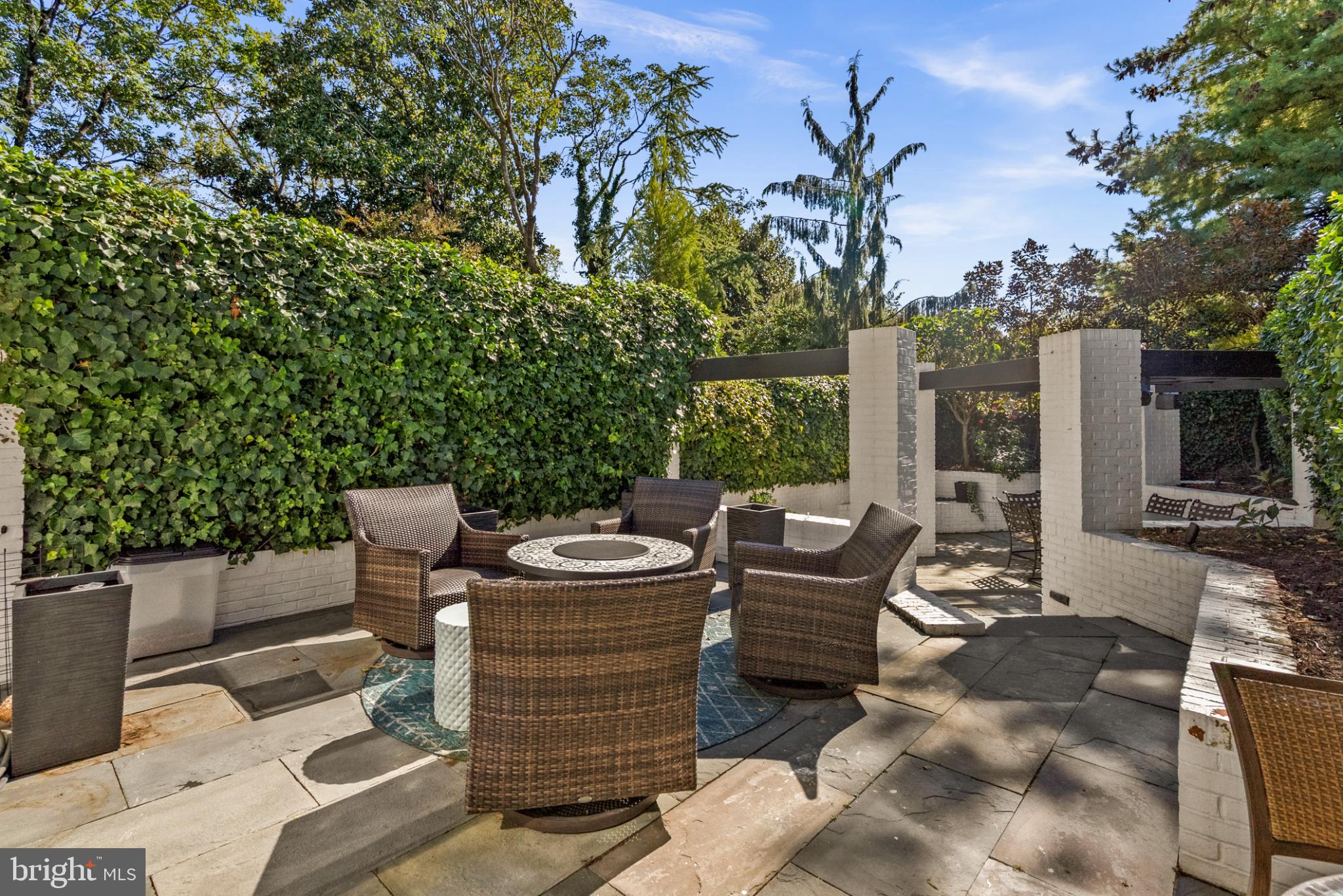 3322 Dent Place Northwest Washington, DC 20007 - Photo 36 of 41 a view of a patio with table and chairs and potted plants