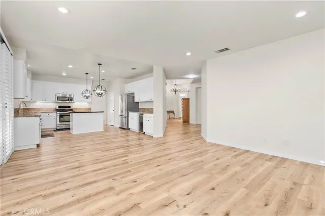 a view of kitchen with wooden floor
