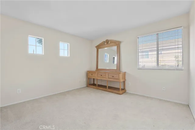 a room with a bed and a window