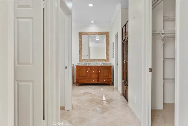 a bathroom with a tub a double vanity sink and a mirror