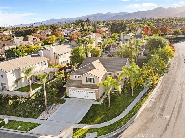 an aerial view of a house with a swimming pool