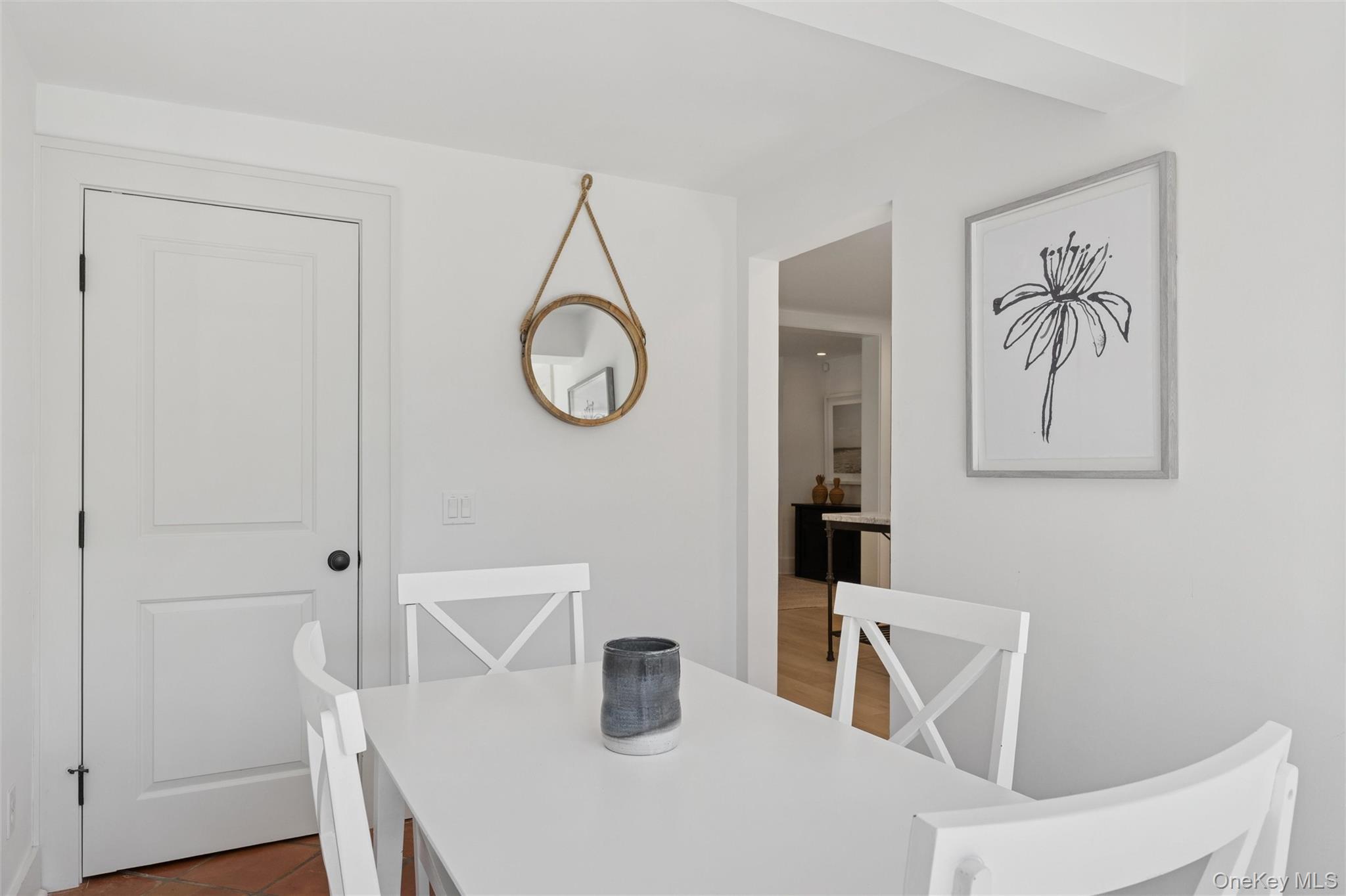 51 Sherrill Road East Hampton, NY 11937 - Photo 13 of 35 a dining room with wooden floor and white cabinet