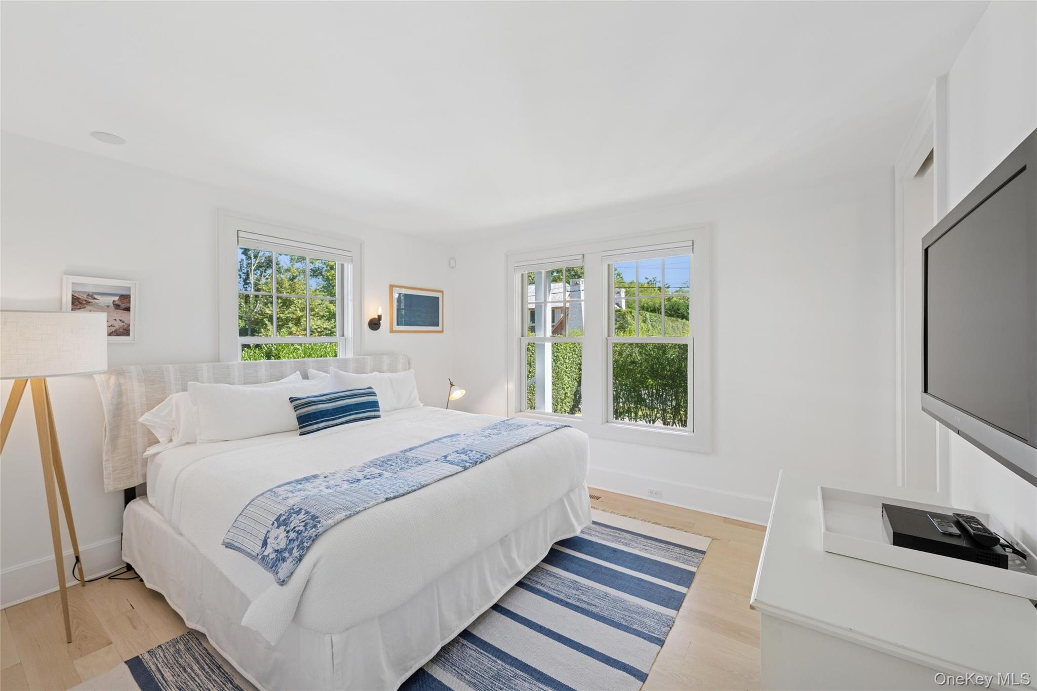 51 Sherrill Road East Hampton, NY 11937 - Photo 14 of 35 a bedroom with a bed and a window