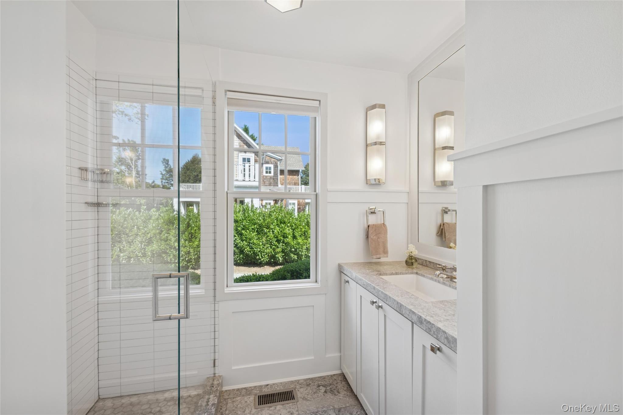 51 Sherrill Road East Hampton, NY 11937 - Photo 16 of 35 a bathroom with a granite countertop sink a toilet and shower