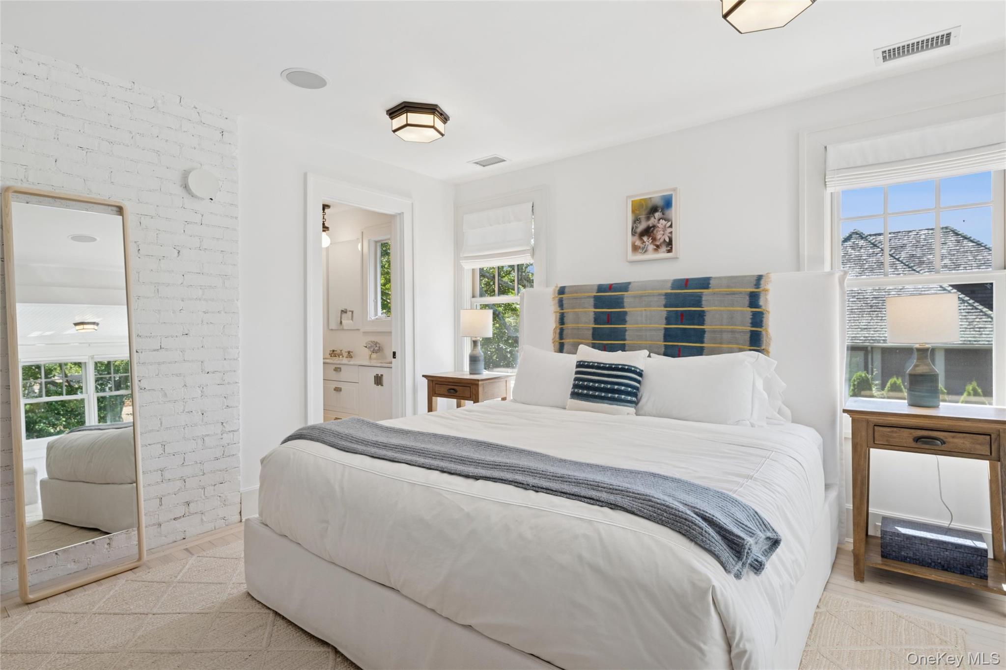 51 Sherrill Road East Hampton, NY 11937 - Photo 18 of 35 a bedroom with a large bed and a window