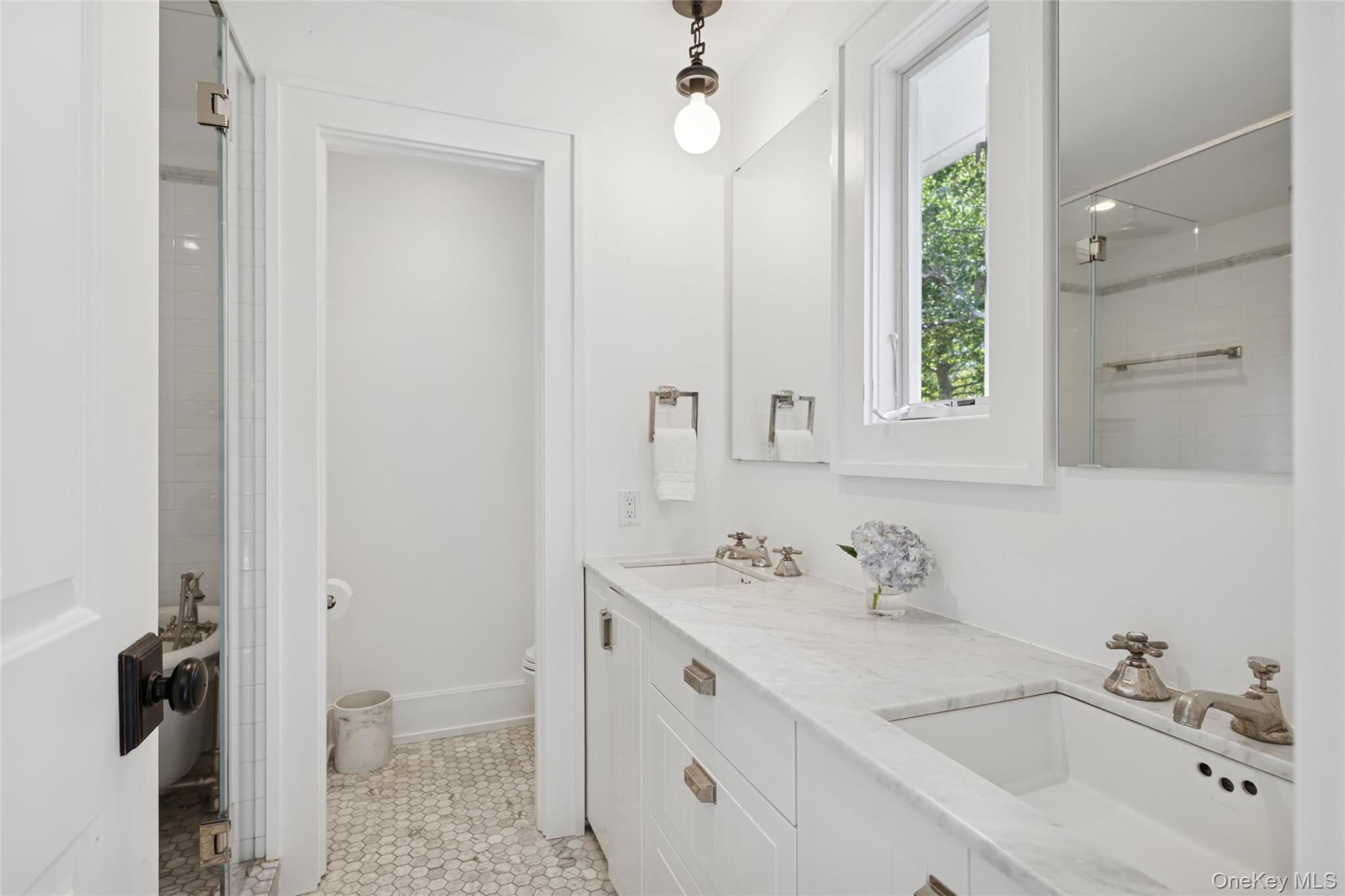 51 Sherrill Road East Hampton, NY 11937 - Photo 21 of 35 a bathroom with a sink vanity and a mirror