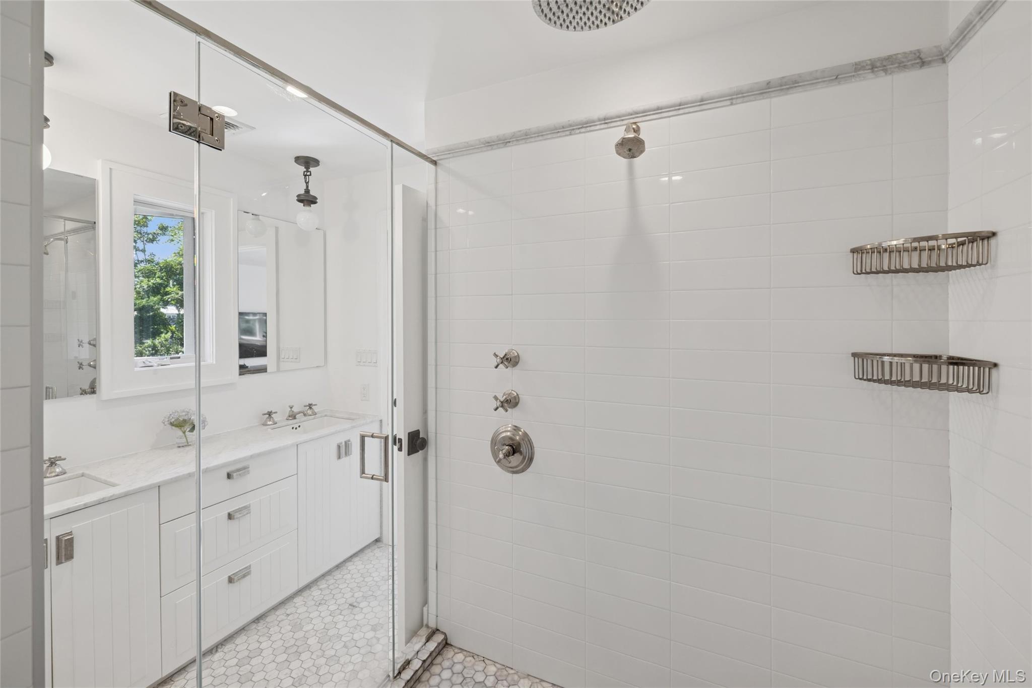 51 Sherrill Road East Hampton, NY 11937 - Photo 22 of 35 a bathroom with a shower sink and mirror