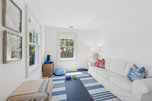a living room with furniture and a rug