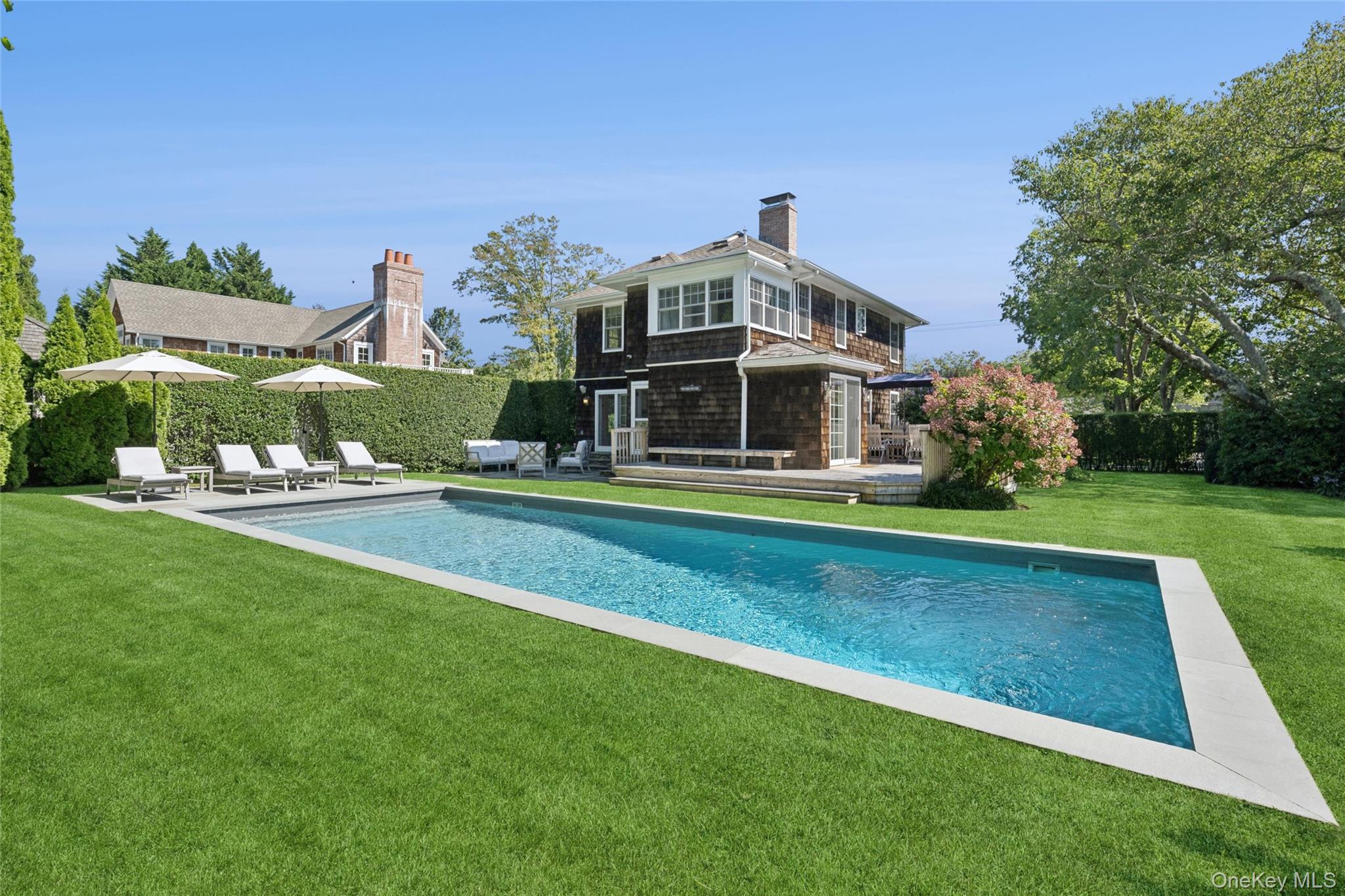 51 Sherrill Road East Hampton, NY 11937 - Photo 34 of 35 a front view of a house with a big yard