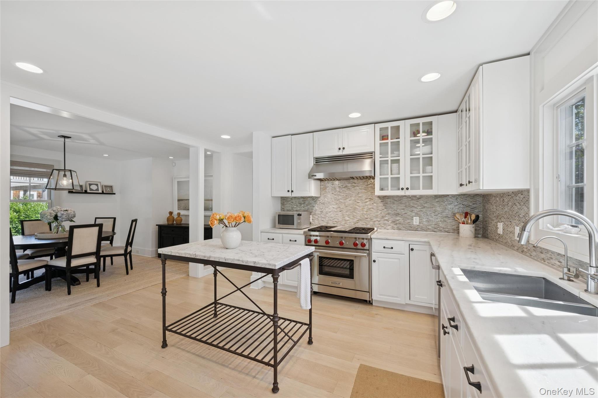 51 Sherrill Road East Hampton, NY 11937 - Photo 8 of 35 a kitchen with stainless steel appliances granite countertop a sink stove and cabinets