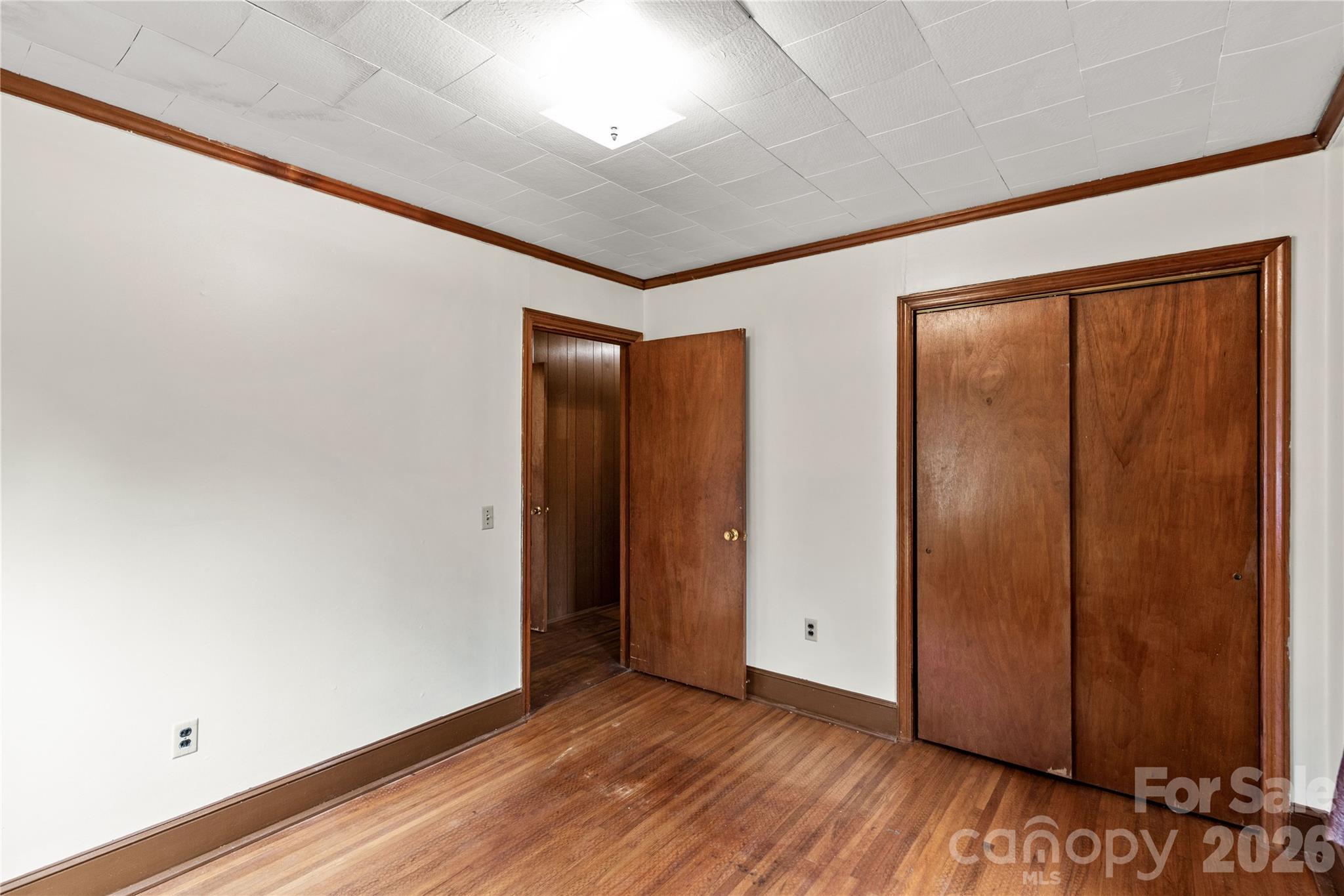 1724 State Rd S-29-39 Lancaster, SC 29720 - Photo 20 of 29 a view of an empty room with wooden floor and a window
